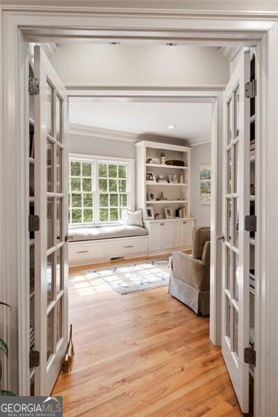 3894 Land O Lakes Dr NE, Atlanta, GA 30342 - sitting room with french doors, light wood-style floors, and crown molding