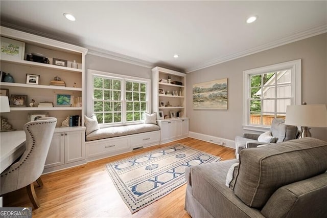 3894 Land O Lakes Dr NE, Atlanta, GA 30342 - living room with ornamental molding, healthy amount of natural light, light wood finished floors, and recessed lighting