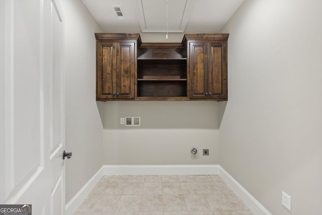 625 Henderson Mill Rd, Covington, GA 30014 - laundry area featuring hookup for an electric dryer, washer hookup, cabinet space, hookup for a gas dryer, and attic access