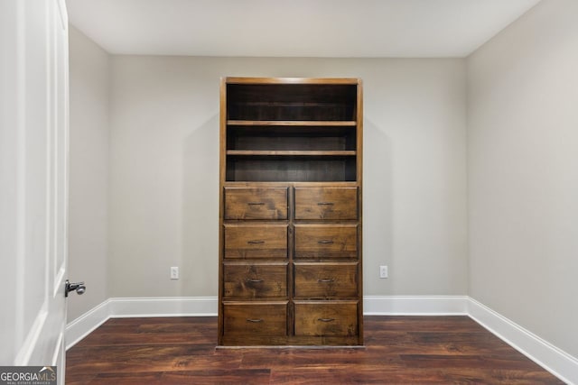 625 Henderson Mill Rd, Covington, GA 30014 - unfurnished bedroom featuring wood finished floors and baseboards
