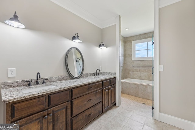 625 Henderson Mill Rd, Covington, GA 30014 - bathroom featuring ornamental molding, double vanity, tiled bath, tile patterned floors, and baseboards