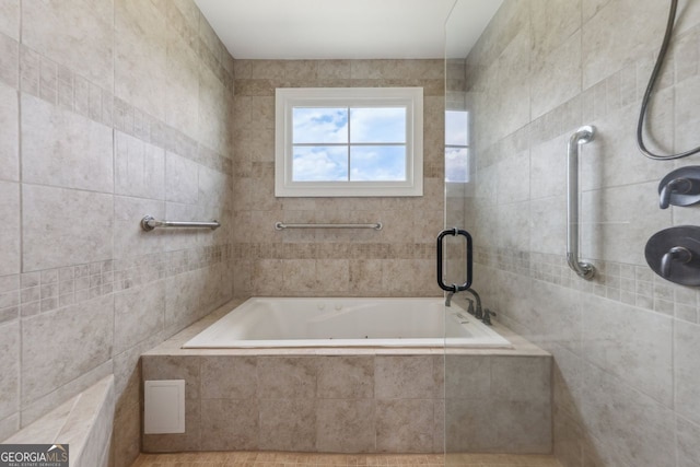 625 Henderson Mill Rd, Covington, GA 30014 - full bathroom featuring a relaxing tiled tub and tiled shower