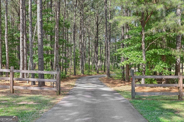 625 Henderson Mill Rd, Covington, GA 30014 - view of road with a wooded view