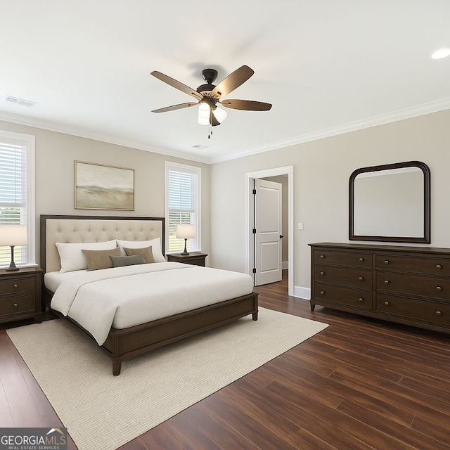 625 Henderson Mill Rd, Covington, GA 30014 - bedroom with ornamental molding, dark wood finished floors, ceiling fan, and baseboards