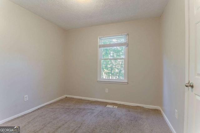 42 Breckenridge Dr, Powder Springs, GA 30127 - empty room with carpet, a textured ceiling, and baseboards