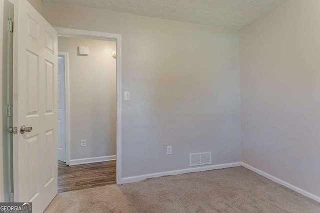 42 Breckenridge Dr, Powder Springs, GA 30127 - spare room with carpet floors, baseboards, and a textured ceiling