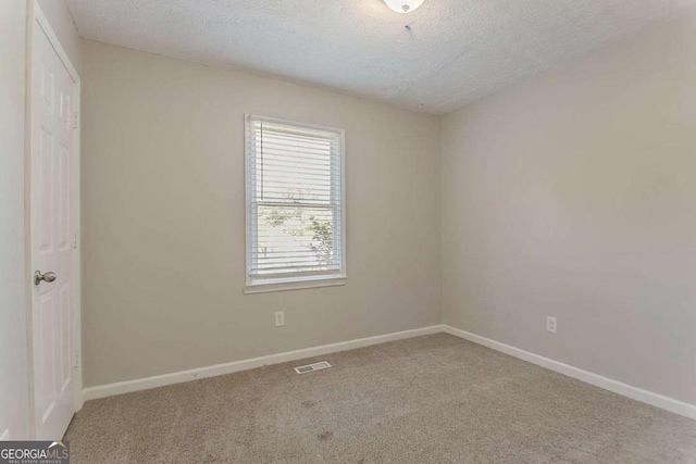 42 Breckenridge Dr, Powder Springs, GA 30127 - carpeted spare room featuring a textured ceiling and baseboards