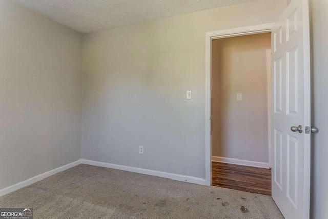 42 Breckenridge Dr, Powder Springs, GA 30127 - carpeted empty room with baseboards and a textured ceiling