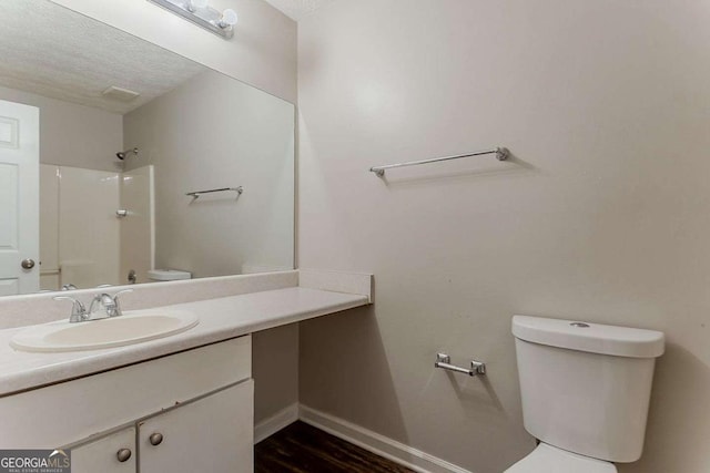 42 Breckenridge Dr, Powder Springs, GA 30127 - bathroom with toilet, vanity, a shower, baseboards, and a textured ceiling