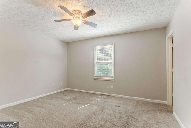 42 Breckenridge Dr, Powder Springs, GA 30127 - carpeted empty room with a textured ceiling, ceiling fan, and baseboards