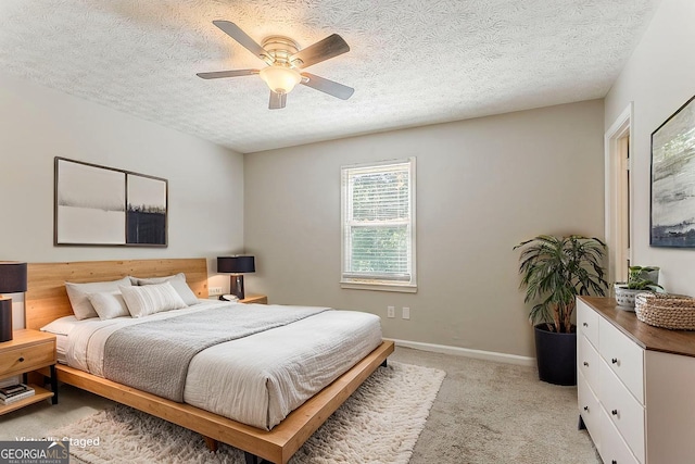 42 Breckenridge Dr, Powder Springs, GA 30127 - bedroom with light carpet, a textured ceiling, ceiling fan, and baseboards