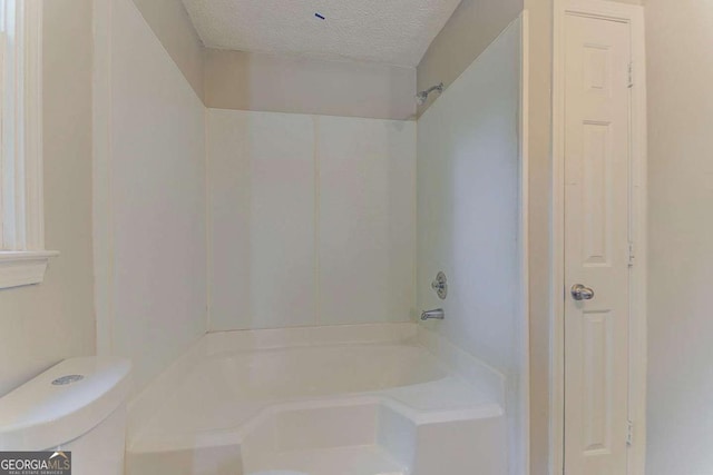 42 Breckenridge Dr, Powder Springs, GA 30127 - full bathroom with a textured ceiling,  shower combination, and toilet