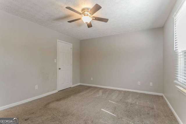 42 Breckenridge Dr, Powder Springs, GA 30127 - unfurnished room with a textured ceiling, ceiling fan, carpet flooring, and baseboards