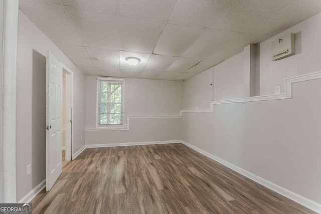 42 Breckenridge Dr, Powder Springs, GA 30127 - unfurnished bedroom featuring wood finished floors, a drop ceiling, and baseboards