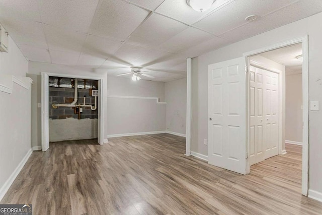 42 Breckenridge Dr, Powder Springs, GA 30127 - finished basement with a ceiling fan, wood finished floors, baseboards, and a paneled ceiling