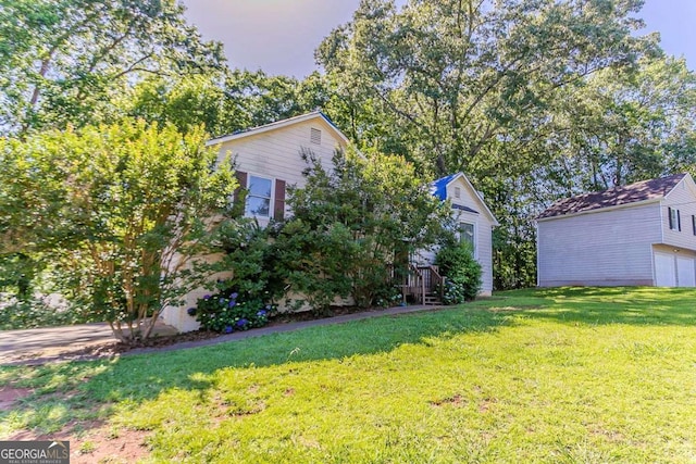 42 Breckenridge Dr, Powder Springs, GA 30127 - view of grassy yard featuring a garage