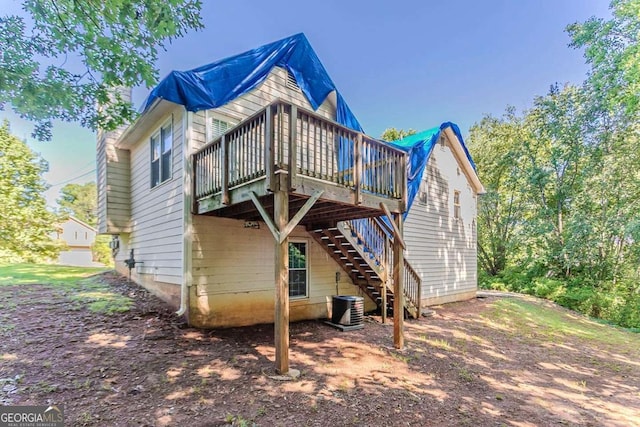 42 Breckenridge Dr, Powder Springs, GA 30127 - back of property featuring stairway, a wooden deck, and cooling unit