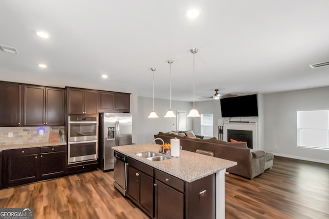 1243 Polk Xing, Mcdonough, GA 30252 - kitchen with appliances with stainless steel finishes, a ceiling fan, dark brown cabinets, dark wood-style flooring, and recessed lighting