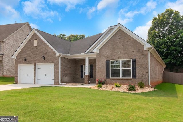 1243 Polk Xing, Mcdonough, GA 30252 - view of front of house with driveway, brick siding, and a garage