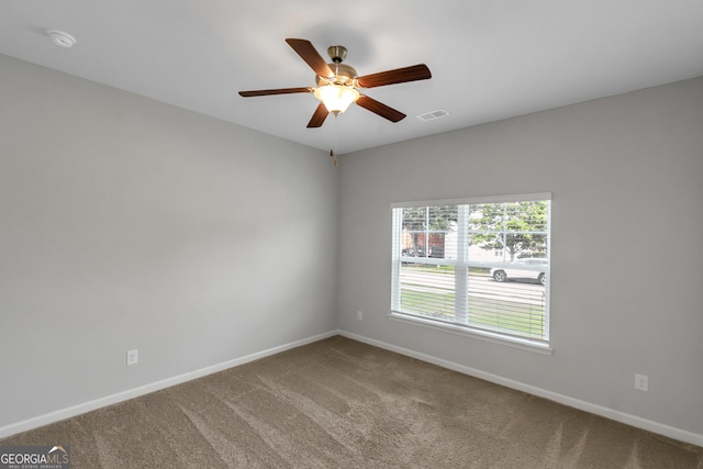 1243 Polk Xing, Mcdonough, GA 30252 - spare room with carpet flooring, ceiling fan, and a smoke detector