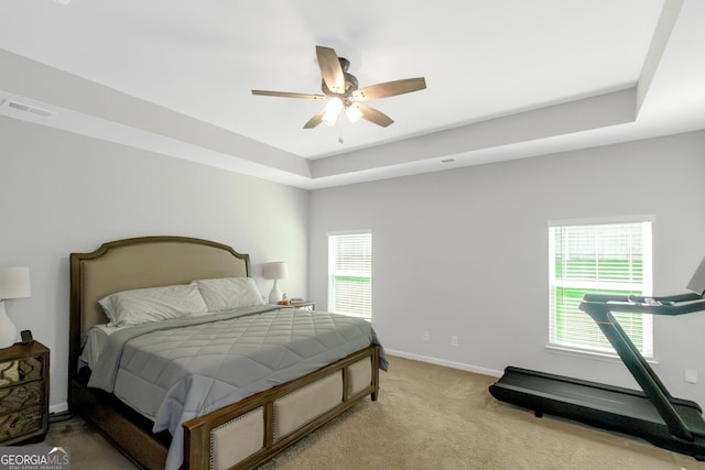 1243 Polk Xing, Mcdonough, GA 30252 - carpeted bedroom with a raised ceiling and a ceiling fan