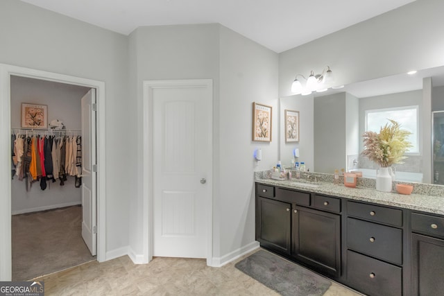 1243 Polk Xing, Mcdonough, GA 30252 - bathroom featuring vanity and a spacious closet