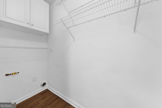 4941 Lighthouse Pointe, Acworth, GA 30101 - laundry area with cabinet space, baseboards, dark wood-style floors, washer hookup, and hookup for an electric dryer