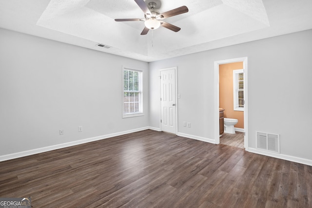 4941 Lighthouse Pointe, Acworth, GA 30101 - unfurnished bedroom with a raised ceiling, dark wood-style floors, baseboards, ensuite bathroom, and a closet