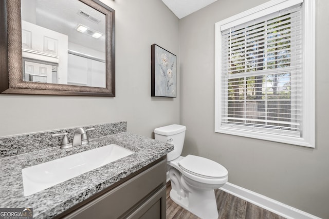 4941 Lighthouse Pointe, Acworth, GA 30101 - bathroom with wood finished floors, toilet, vanity, and baseboards