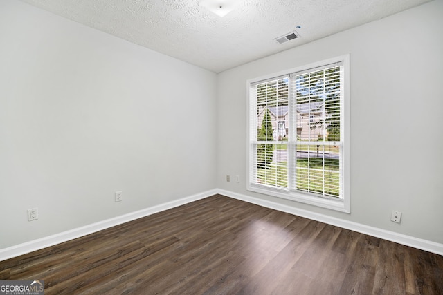 4941 Lighthouse Pointe, Acworth, GA 30101 - spare room featuring baseboards, dark wood-style flooring, and a textured ceiling