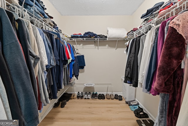 1450 Steam Engine Way NE, Conyers, GA 30013 - walk in closet with wood finished floors