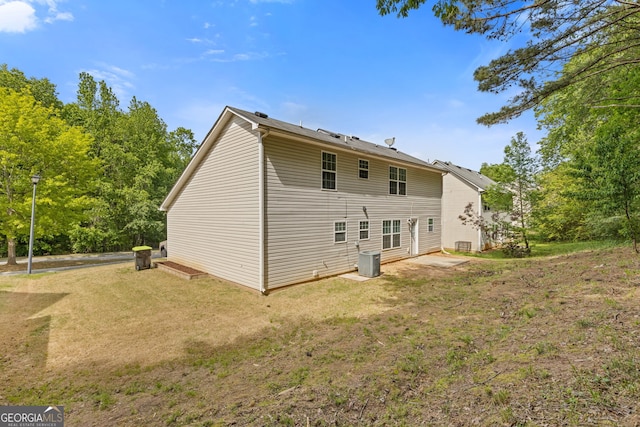 1450 Steam Engine Way NE, Conyers, GA 30013 - back of property featuring a yard and a patio area
