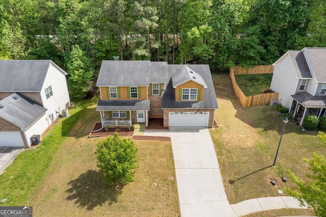1450 Steam Engine Way NE, Conyers, GA 30013 - traditional home with a porch, concrete driveway, roof with shingles, and brick siding