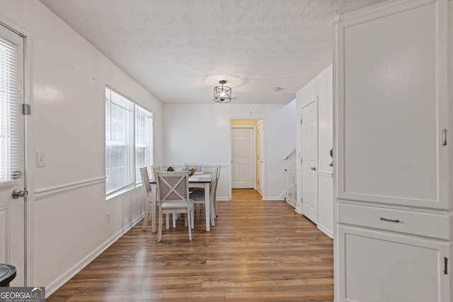 1450 Steam Engine Way NE, Conyers, GA 30013 - dining area with wood finished floors and a textured ceiling
