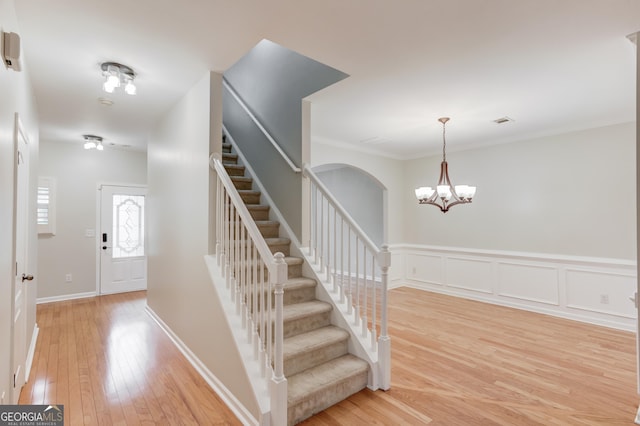 2725 Sedgeview Way, Buford, GA 30519 - staircase featuring wood-type flooring and a chandelier