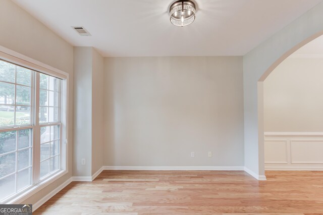 2725 Sedgeview Way, Buford, GA 30519 - empty room featuring light wood-type flooring and arched walkways