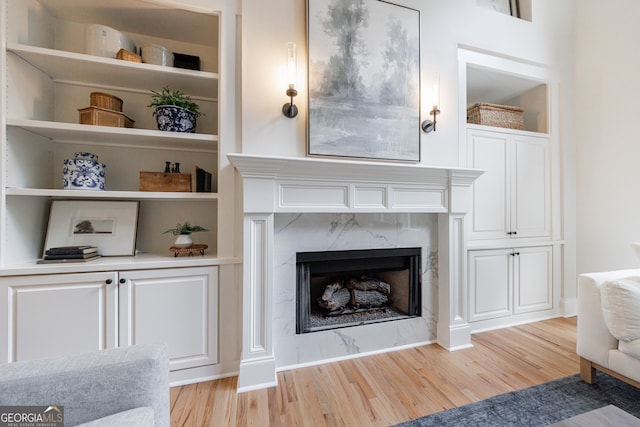 2101 Hunters Green Dr, Lawrenceville, GA 30043 - living room with light wood-style floors, a fireplace, and built in shelves