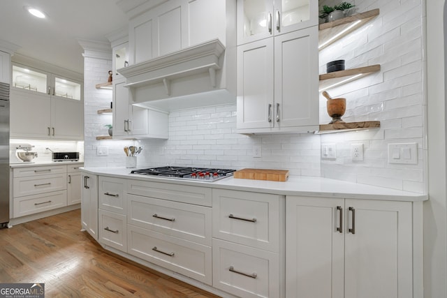 2101 Hunters Green Dr, Lawrenceville, GA 30043 - kitchen featuring open shelves, tasteful backsplash, white cabinetry, stainless steel gas stovetop, and light countertops