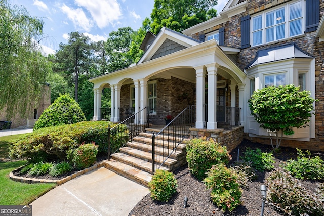 2101 Hunters Green Dr, Lawrenceville, GA 30043 - view of front of property with stone siding and covered porch