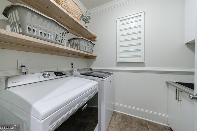 2101 Hunters Green Dr, Lawrenceville, GA 30043 - laundry room with washing machine and dryer, ornamental molding, wainscoting, baseboards, and dark tile patterned flooring