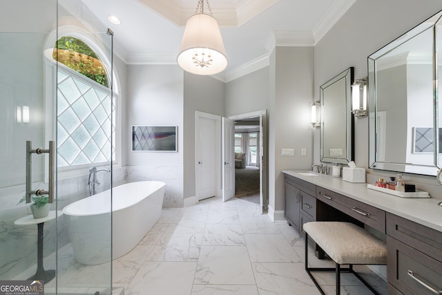 2101 Hunters Green Dr, Lawrenceville, GA 30043 - bathroom featuring vanity, a freestanding bath, crown molding, marble finish floors, and a stall shower