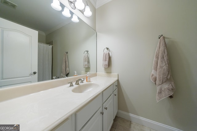 2101 Hunters Green Dr, Lawrenceville, GA 30043 - bathroom featuring ornamental molding, vanity, and baseboards