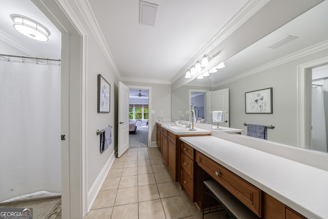 2101 Hunters Green Dr, Lawrenceville, GA 30043 - ensuite bathroom featuring vanity, crown molding, tile patterned flooring, and baseboards