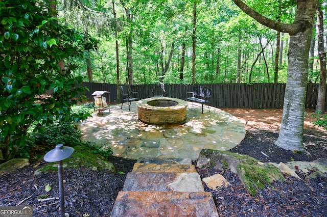 2101 Hunters Green Dr, Lawrenceville, GA 30043 - view of patio featuring an outdoor fire pit