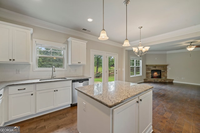 4650 Pleasant Woods Dr, Cumming, GA 30028 - kitchen featuring dishwasher, a sink, dark wood-style flooring, backsplash, and white cabinetry