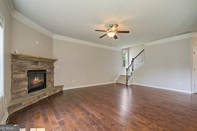 4650 Pleasant Woods Dr, Cumming, GA 30028 - unfurnished living room featuring ceiling fan, ornamental molding, a stone fireplace, hardwood / wood-style floors, and stairway