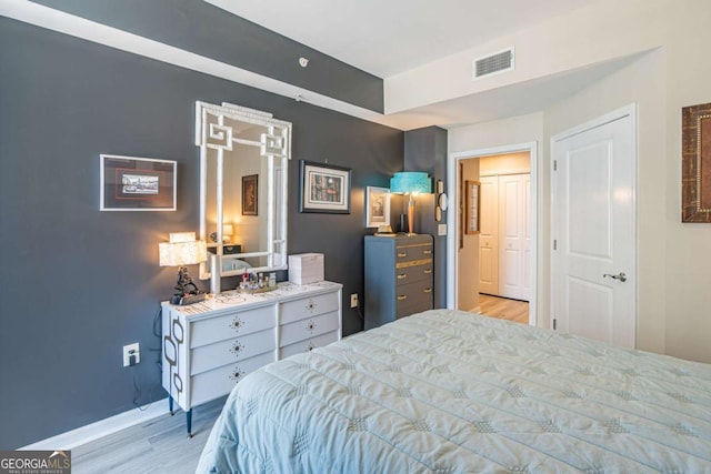 3040 Peachtree Rd NW Unit 1013, Atlanta, GA 30305 - bedroom featuring light wood-style flooring and baseboards