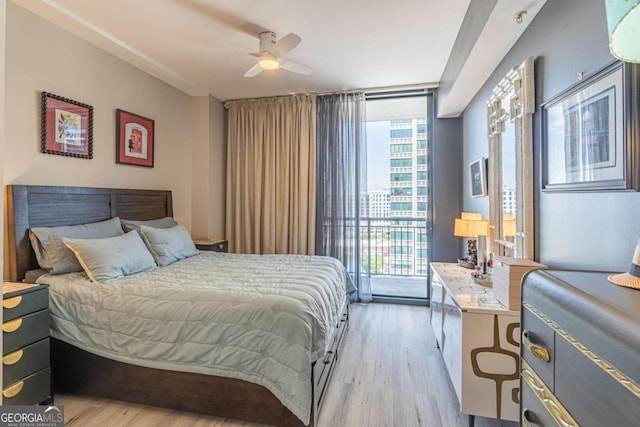 3040 Peachtree Rd NW Unit 1013, Atlanta, GA 30305 - bedroom featuring floor to ceiling windows, light wood-style floors, access to outside, multiple windows, and ceiling fan