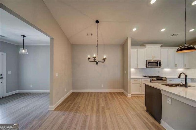 349 Creek Wood Park Dr, Ball Ground, GA 30107 - kitchen featuring stainless steel appliances, light wood-style flooring, white cabinets, and recessed lighting