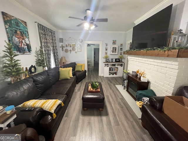 1103 E 2nd Ave SE, Rome, GA 30161 - living area with wood finished floors, crown molding, a ceiling fan, and a fireplace